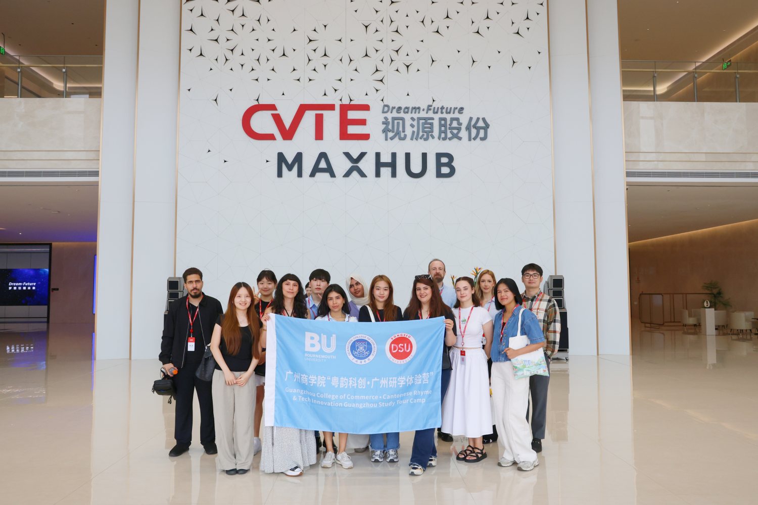 The cohort and our BU banner at the CVTE MAXHUB wall
