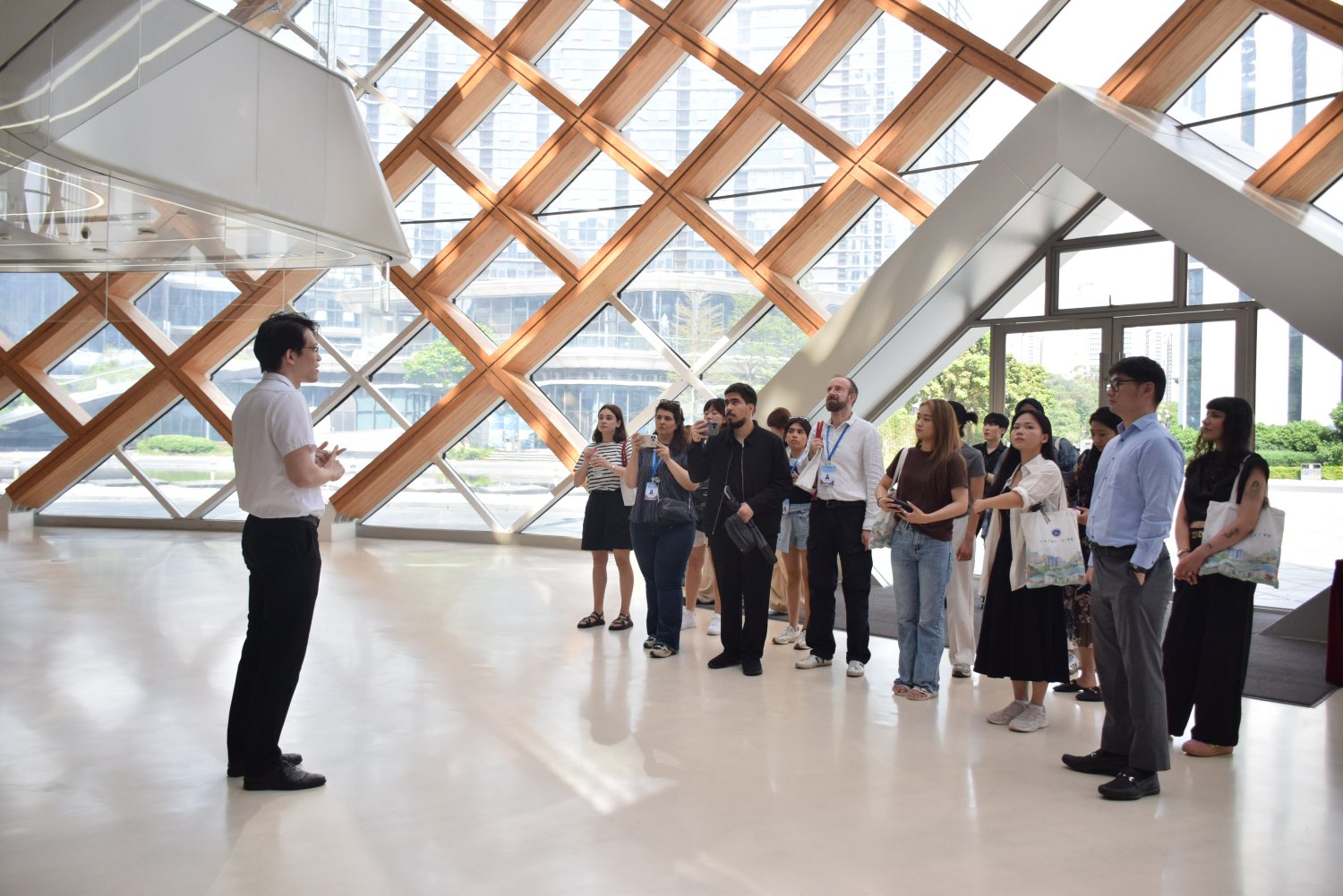 A guide leads us past the exhibits, under the dome's wooden lattice