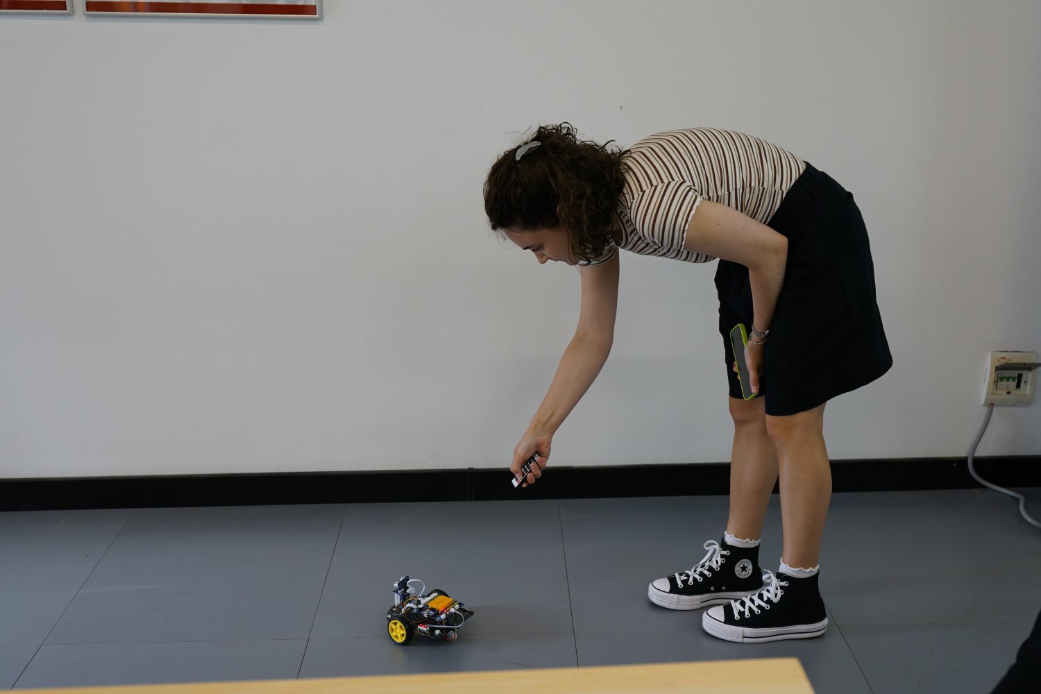The payoff: a small obstacle-avoidance car crossing the classroom floor on its own.